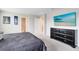 Comfortable bedroom features neutral carpeting, television, and ample closet space at 261 Whistling Duck Trl, St Cloud, FL 34771