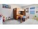 Fun bedroom with a wooden bunk bed, built-in drawers, and neutral carpeting at 261 Whistling Duck Trl, St Cloud, FL 34771
