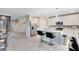 Bright kitchen featuring stainless steel appliances, a center island with bar seating and tile flooring at 261 Whistling Duck Trl, St Cloud, FL 34771