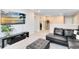 Cozy living room features a plush sectional sofa, television, and neutral decor at 261 Whistling Duck Trl, St Cloud, FL 34771