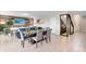 Open-concept living space with dining area, featuring modern decor, and a stylish wine storage at 261 Whistling Duck Trl, St Cloud, FL 34771