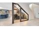 Custom wine cellar featuring glass enclosure, beverage cooler, and stylish bottle storage at 261 Whistling Duck Trl, St Cloud, FL 34771