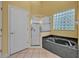 The bathroom has a glass-enclosed shower and a soaking tub with tile surround, offering a spa-like experience at 2954 Willow Bay Ter, Casselberry, FL 32707