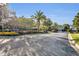 Gated Lakehurst community entrance with palm trees, landscaping, and signage at 2954 Willow Bay Ter, Casselberry, FL 32707