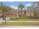 Charming single-Gathering home featuring a well-manicured lawn and mature landscaping at 2954 Willow Bay Ter, Casselberry, FL 32707