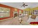Comfortable living room featuring a fireplace and easy access to the pool area for relaxed indoor-outdoor living at 2954 Willow Bay Ter, Casselberry, FL 32707