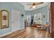 Bright home office with hardwood floors, ceiling fan, and natural light from two shuttered windows at 2954 Willow Bay Ter, Casselberry, FL 32707