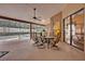 This covered patio offers a dining table, comfortable seating, and views of the screened-in pool area at 2954 Willow Bay Ter, Casselberry, FL 32707