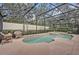 The screened-in pool area includes a spa and lush landscaping, offering a private and relaxing oasis at 2954 Willow Bay Ter, Casselberry, FL 32707