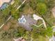 Expansive home boasts a private pool, lush landscaping and meticulously maintained grounds at 2991 Timpana Pt, Longwood, FL 32779