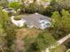 Aerial view of home showcasing the pool and landscaping at 2991 Timpana Pt, Longwood, FL 32779