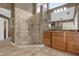 Modern bathroom featuring a glass enclosed shower and double vanity with granite countertop at 2991 Timpana Pt, Longwood, FL 32779