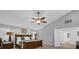 Spacious bedroom featuring a ceiling fan, neutral paint, carpet flooring and an ensuite bathroom entrance at 2991 Timpana Pt, Longwood, FL 32779