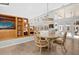 Cozy dining area featuring a round table, wicker chairs, and built-in shelving, perfect for Gathering meals and gatherings at 2991 Timpana Pt, Longwood, FL 32779