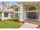 Stunning exterior features a grand front entrance with tiled walkway and manicured landscaping at 2991 Timpana Pt, Longwood, FL 32779