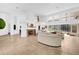 Bright and airy living room with fireplace, tile floors, and large windows overlooking the pool at 2991 Timpana Pt, Longwood, FL 32779