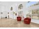 Bright living room with tile flooring, tall ceilings, and many windows that let in natural light at 2991 Timpana Pt, Longwood, FL 32779
