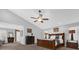 Main bedroom features a ceiling fan, soft carpet and bright light from surrounding windows at 2991 Timpana Pt, Longwood, FL 32779