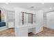 Walk-in closet featuring custom shelving, drawers and a vanity area with Hollywood mirror at 2991 Timpana Pt, Longwood, FL 32779