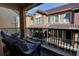 Private balcony with seating area featuring wrought iron railing and views of neighboring villas at 3345 Messina Dr, Lake Mary, FL 32746