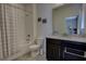 Bathroom featuring granite counters, black vanity, and shower-tub combination at 3345 Messina Dr, Lake Mary, FL 32746