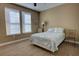 Bedroom with carpet, two windows with blinds, and blue floral bedding at 3345 Messina Dr, Lake Mary, FL 32746