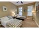 Bedroom featuring two twin beds, a ceiling fan, and multiple windows at 3345 Messina Dr, Lake Mary, FL 32746