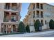 Attractive condo with balconies, front stairs, black railings, and lush landscaping at 3345 Messina Dr, Lake Mary, FL 32746
