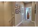 Neutral hallway with wall decor, showing laundry and closet access at 3345 Messina Dr, Lake Mary, FL 32746