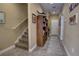 Neutral hallway featuring tile flooring, staircase, and decor at 3345 Messina Dr, Lake Mary, FL 32746