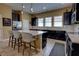 Kitchen featuring dark cabinets, stainless appliances, granite countertops, and a large kitchen island at 3345 Messina Dr, Lake Mary, FL 32746