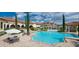 Community pool area with lounge chairs, umbrellas, and a beautiful Mediterranean-style clubhouse at 3345 Messina Dr, Lake Mary, FL 32746