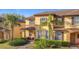 Charming two-story townhome with a well-maintained front yard and lovely landscaping at 4103 Calabria Ave, Davenport, FL 33897