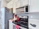 Kitchen featuring stainless steel appliances, range, and marbled countertops at 4103 Calabria Ave, Davenport, FL 33897