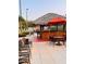 Tropical-themed poolside bar with thatched roof, ideal for enjoying refreshments by the pool at 4103 Calabria Ave, Davenport, FL 33897