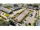Aerial view of community showcasing a tennis court, parking, and lush landscaping for enjoyable outdoor living at 4215 S Semoran Blvd # 2, Orlando, FL 32822