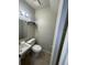 Cozy bathroom with a single sink vanity and toilet at 4215 S Semoran Blvd # 2, Orlando, FL 32822