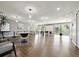 Spacious common room with wood floors, ample seating, and access to the outdoors at 4215 S Semoran Blvd # 2, Orlando, FL 32822