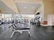 Community fitness center with weight machines, cardio equipment, and mirrors for a comprehensive workout at 4215 S Semoran Blvd # 2, Orlando, FL 32822