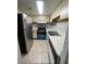 Functional kitchen with stainless steel refrigerator, electric stove, and white countertops at 4215 S Semoran Blvd # 2, Orlando, FL 32822