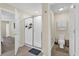 Well-lit bathroom with tiled floors and a glass-enclosed shower at 429 N Andrea Cir, Haines City, FL 33844