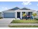 Charming single-story home with a well-maintained lawn and a welcoming front porch at 429 N Andrea Cir, Haines City, FL 33844