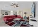 Open-concept living room with view to the kitchen, seamlessly blending living and dining spaces at 429 N Andrea Cir, Haines City, FL 33844
