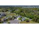 Aerial view featuring residences with fenced yards and well-kept landscaping, against a backdrop of dense trees at 4919 Culdesac Ct, St Cloud, FL 34772