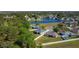 An aerial view of a lovely neighborhood community, highlighting serene lake views, lush greenery, and fenced yards at 4919 Culdesac Ct, St Cloud, FL 34772