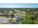 Neighborhood aerial view with well-maintained lawns, privacy fences, and mature trees in a residential area at 4919 Culdesac Ct, St Cloud, FL 34772