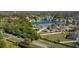 An aerial perspective showcasing a lovely neighborhood community with serene lake views and lush greenery at 4919 Culdesac Ct, St Cloud, FL 34772