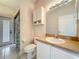 Bathroom with a toilet, sink, mirror, and an exterior door at 4919 Culdesac Ct, St Cloud, FL 34772