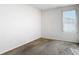 Empty carpeted bedroom with natural light and a window at 4919 Culdesac Ct, St Cloud, FL 34772