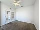 Bedroom highlighting French doors, neutral carpet, blinds on the windows, and access to other rooms at 4919 Culdesac Ct, St Cloud, FL 34772